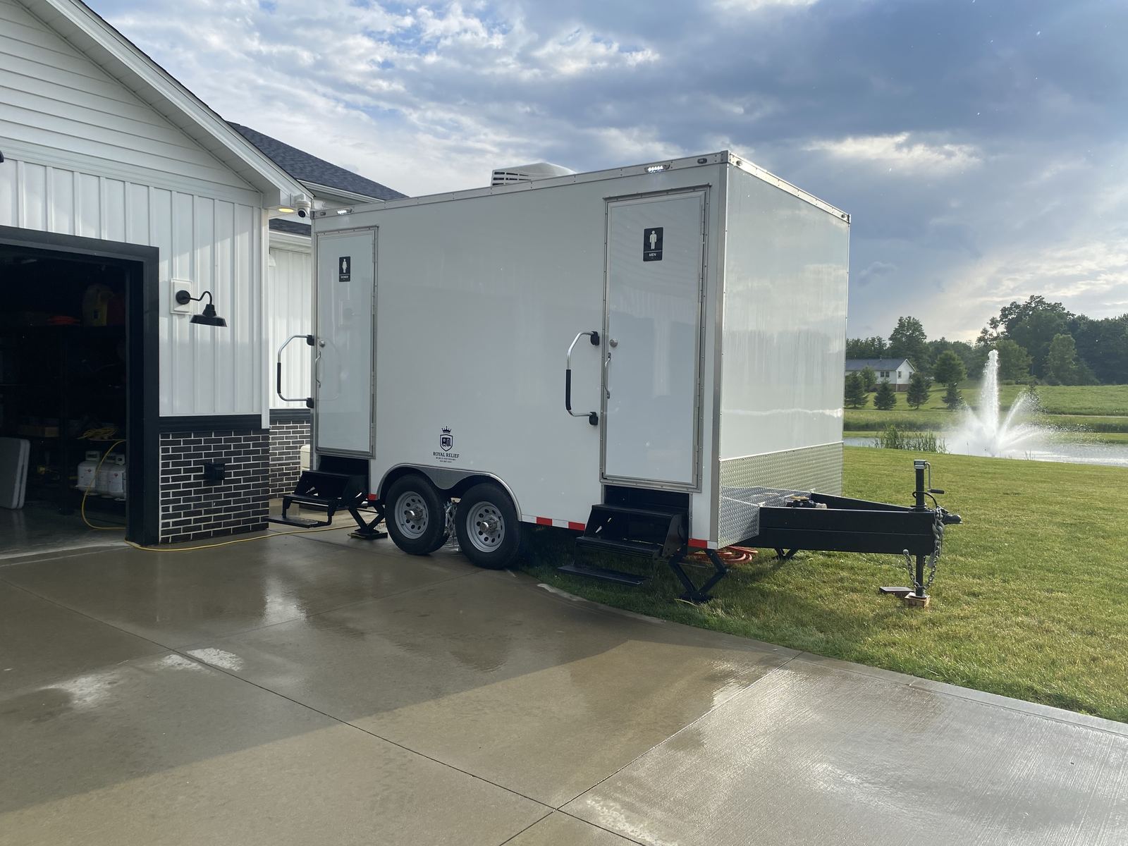 Royal Relief restroom trailer set up in a driveway